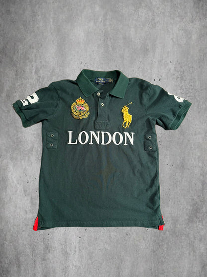 Green polo shirt with 'London' text and brand logo on a gray background